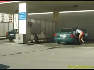 Gal Peeing in car washing